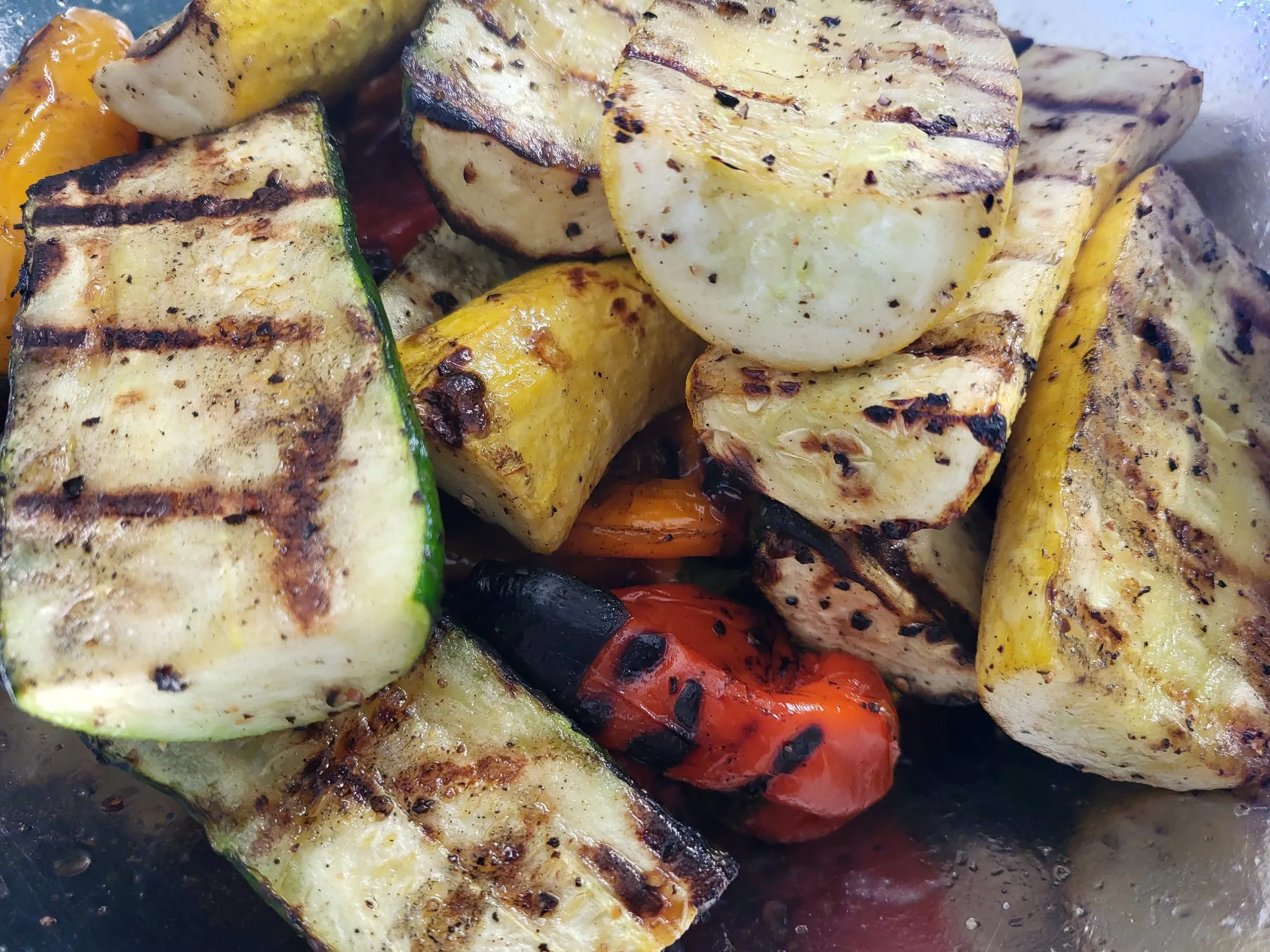 Grilled zucchini, yellow squash and charred red peppers