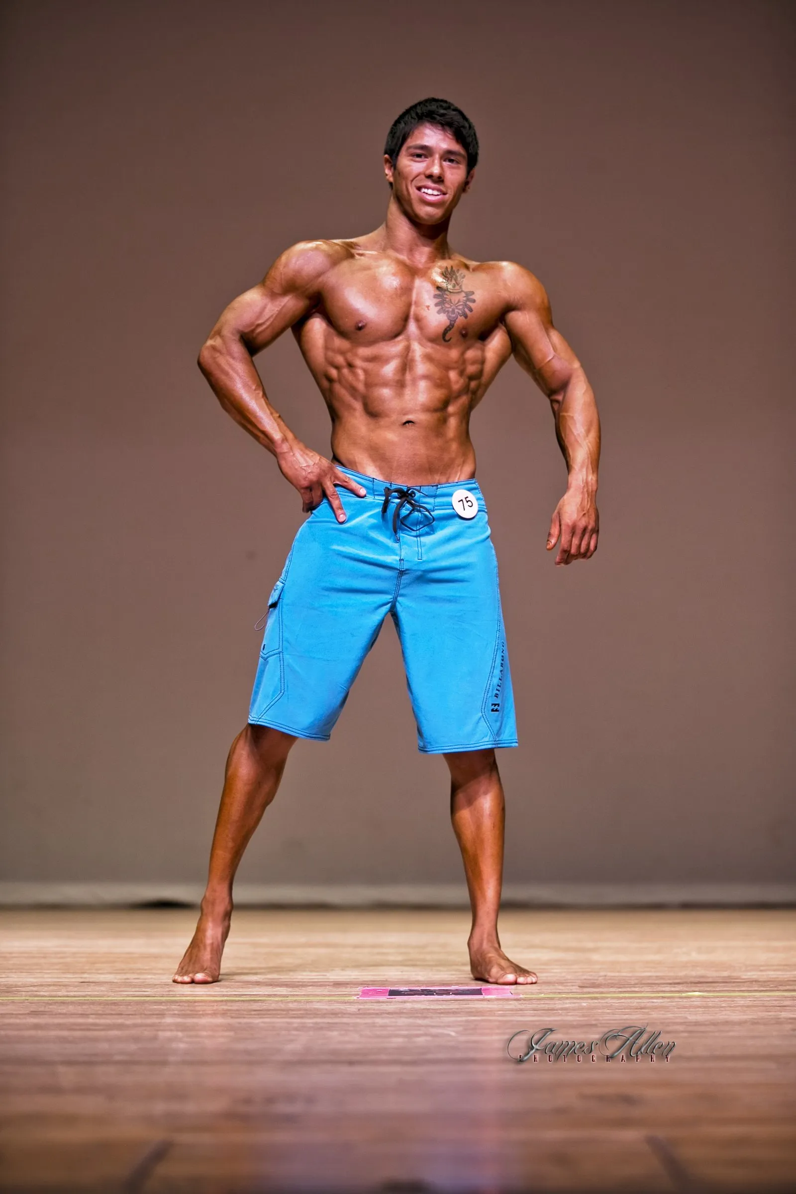 Luis Bosch on stage at a physique competition